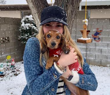 Karlie Fisher and her dog in the snow